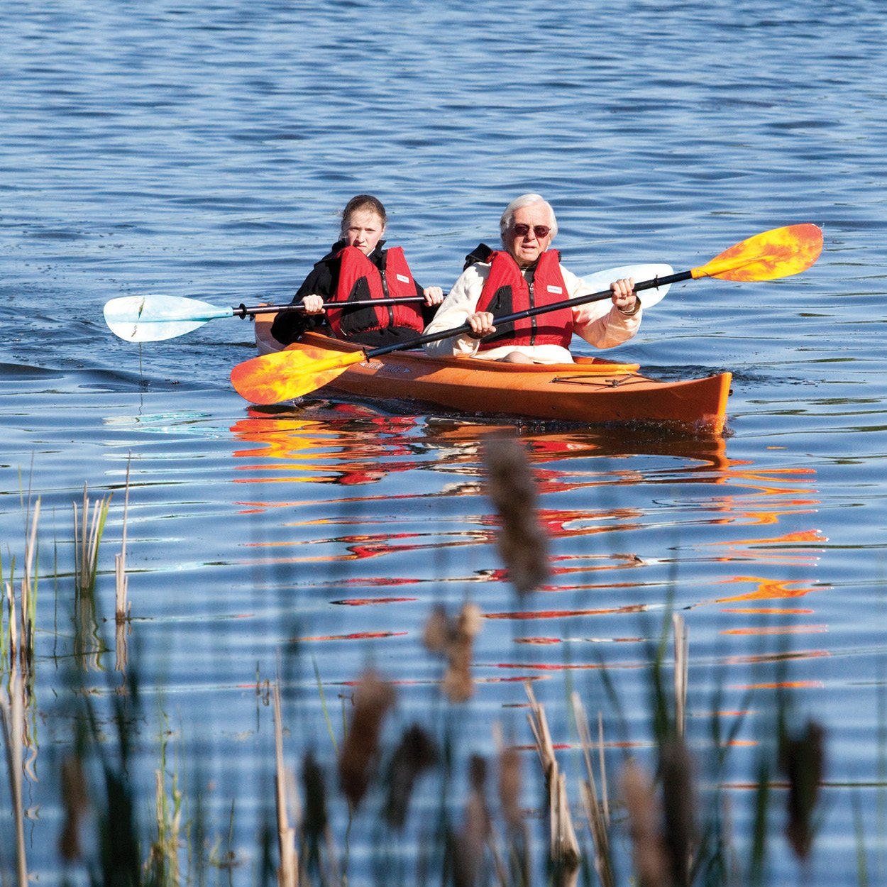 Two people in a kayak on a lake